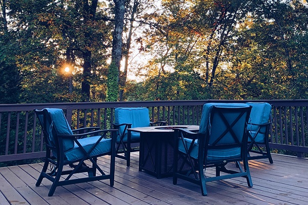 Firepit furniture - outdoor armchairs and firepit table on a deck